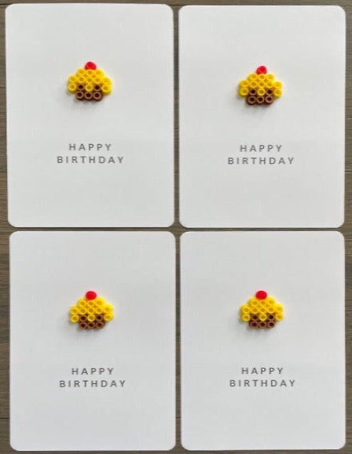 Picture of a set of 4 Happy Birthday cards that each have a yellow cupcake on them