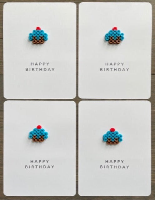 Picture of a set of 4 Happy Birthday cards that have a blue cupcake on each one