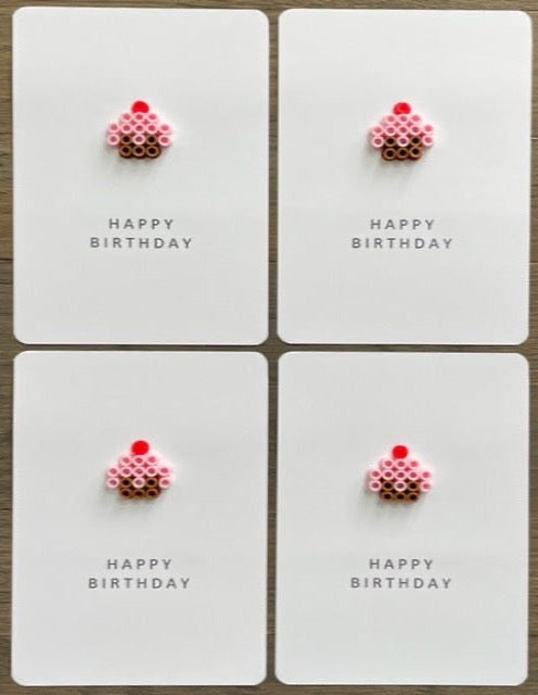 Picture of a set of 4 Happy Birthday cards with a pink cupcake on each