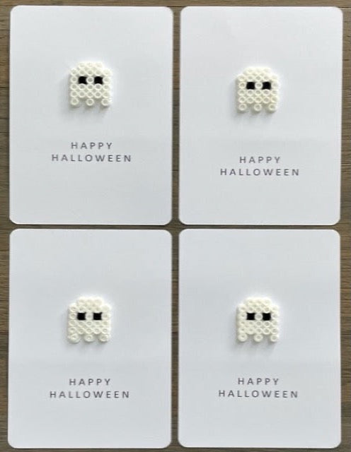Picture of a set of 4 Happy Halloween cards that each have a ghost on them