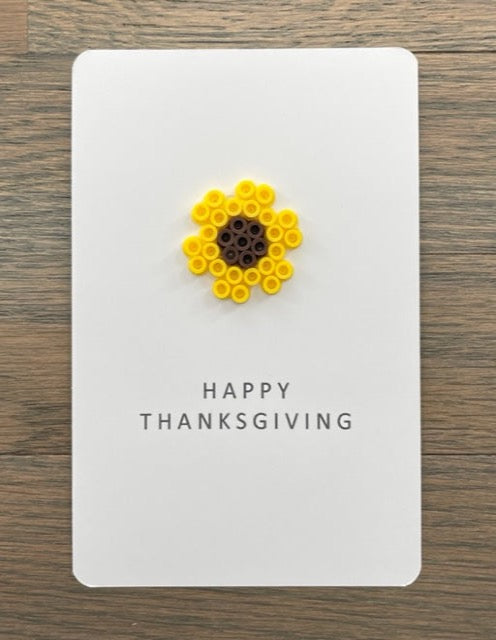 Picture of a Happy Thanksgiving card with a sunflower on it