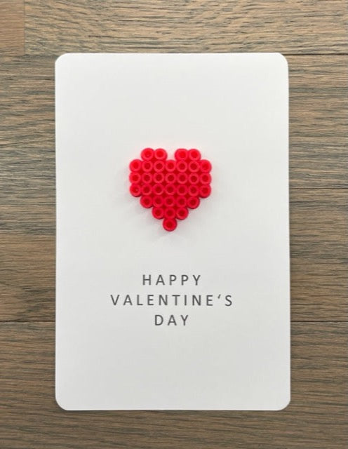 Picture of a Happy Valentine's Day card with a red heart on it