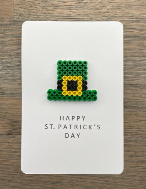 Picture of a Happy St. Patrick's Day card with a green hat that has a yellow buckle on it