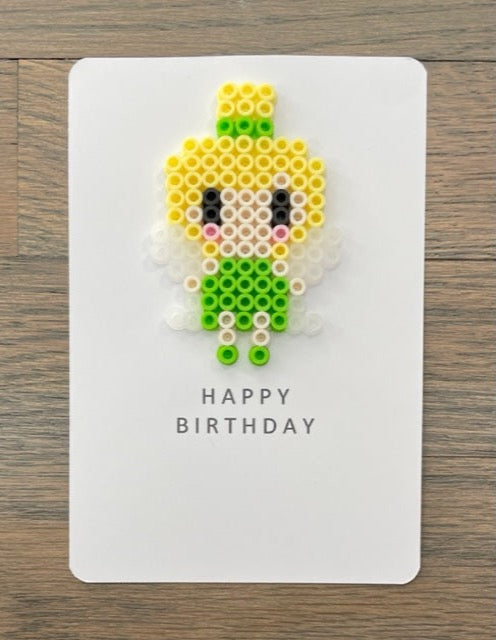 Picture of a Happy Birthday card that has a fairy dressed in a lime green outfit and has yellow hair