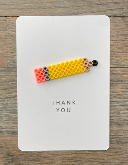 Picture of Thank you card with a pencil on it