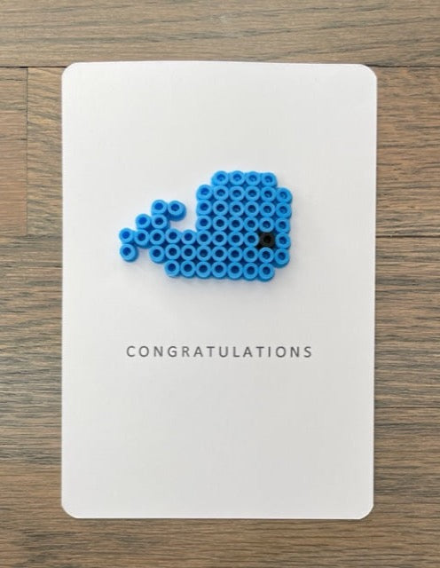Picture of a Congratulations card with a blue whale on it