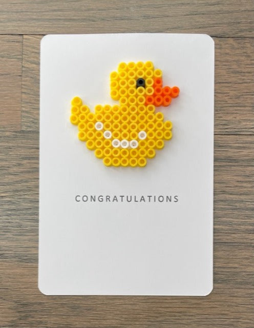 Picture of Congratulations card that has a yellow duck on it