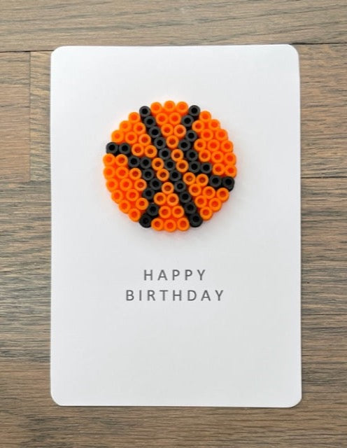 Picture of a Happy Birthday card that has a basketball on it
