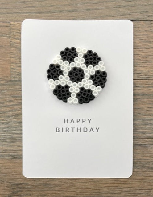 Picture of a Happy Birthday card with a soccer ball on it