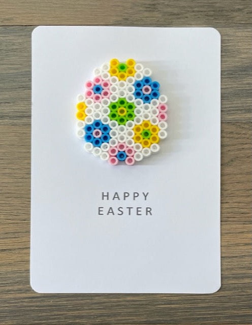 Picture of Happy Easter card with a white, blue, pink, yellow, lime green egg on it