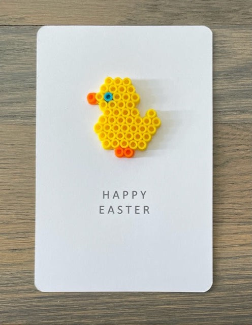 Happy Easter card with a yellow chick on it