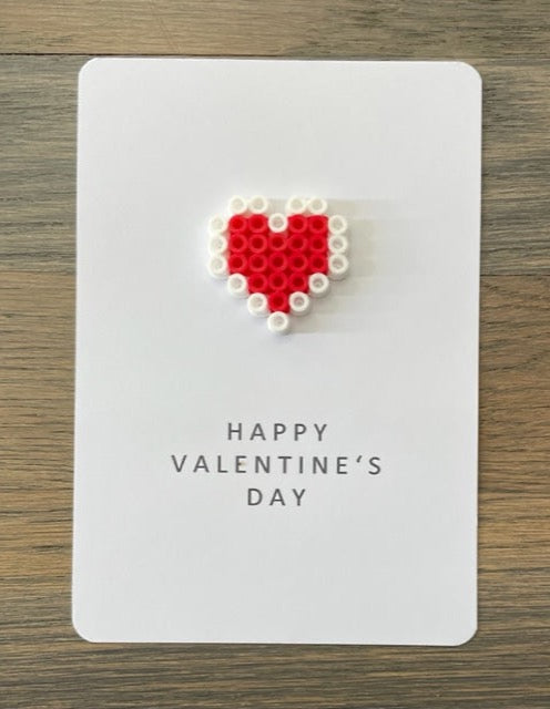 Picture of a Happy Valentine's Day card with a red and white heart on it