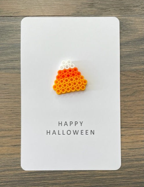 Picture of a Happy Halloween card with a candy corn on it