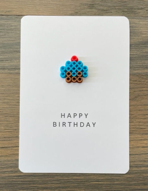 Picture of Happy Birthday card with a blue cupcake on it
