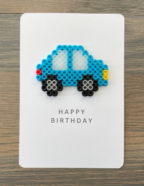 Picture of Happy Birthday card with a blue car on it