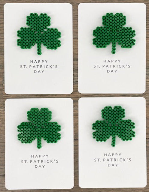 Picture of a set of 4 Happy St. Patrick's Day cards that each have a 3 leaf clover on it
