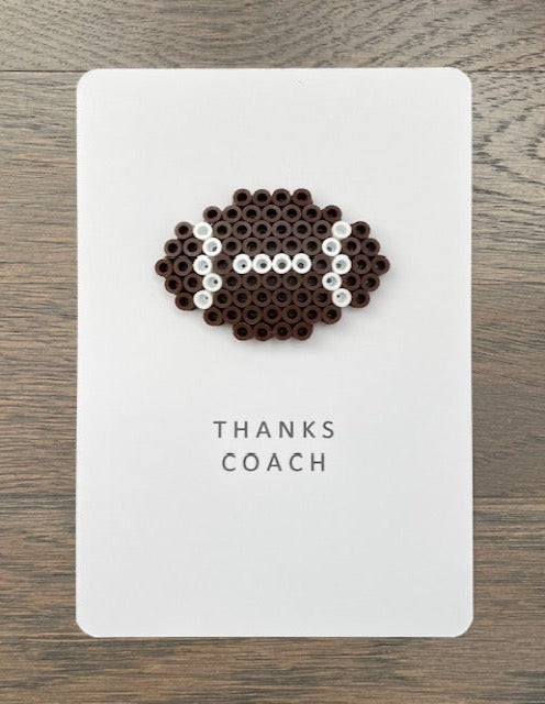 Picture of a card to thank a coach for a great season.  The card says Thanks Coach and has a football on it