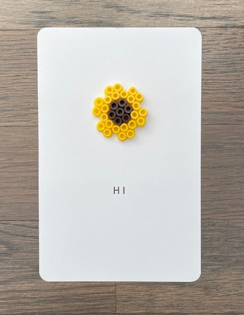 Picture of a Hi card with a sunflower on it