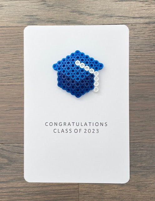 Picture of Congratulations Class of 2023 card that has a blue with white tassel graduation cap on it
