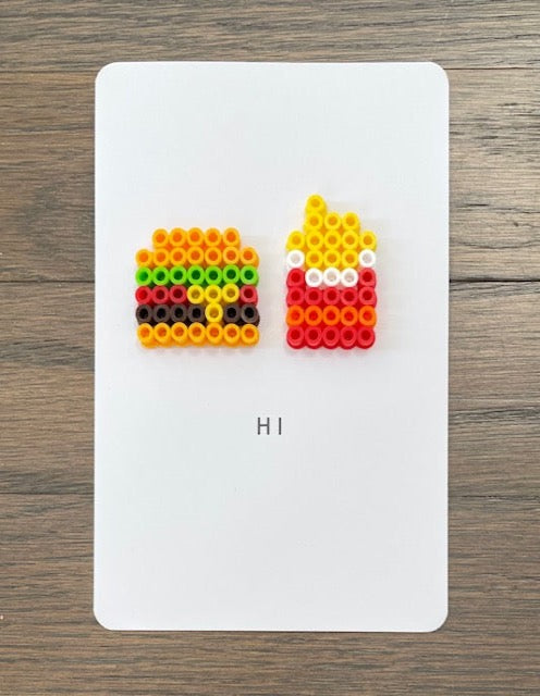Picture of burger and fries on a card that says Hi.