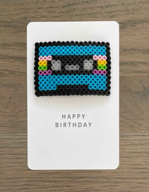 Picture of Happy Birthday card that has a cassette tape on it.