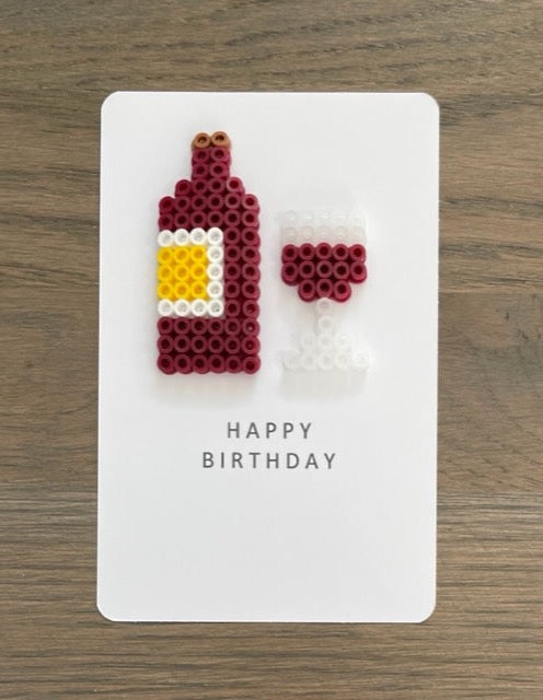 Wine bottle and Glass on a Happy Birthday card.