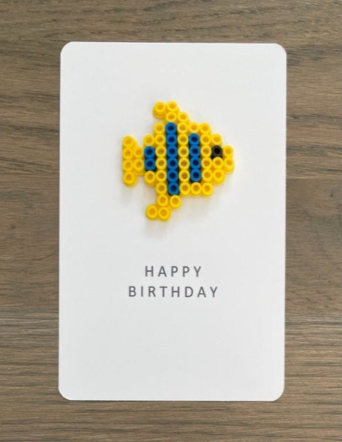 Picture of Happy Birthday card with a yellow fish on it.