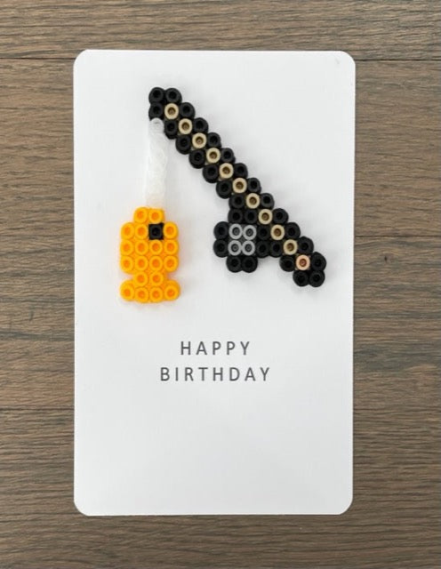 Picture of a Happy Birthday card that has a fishing pole with a fish its line.