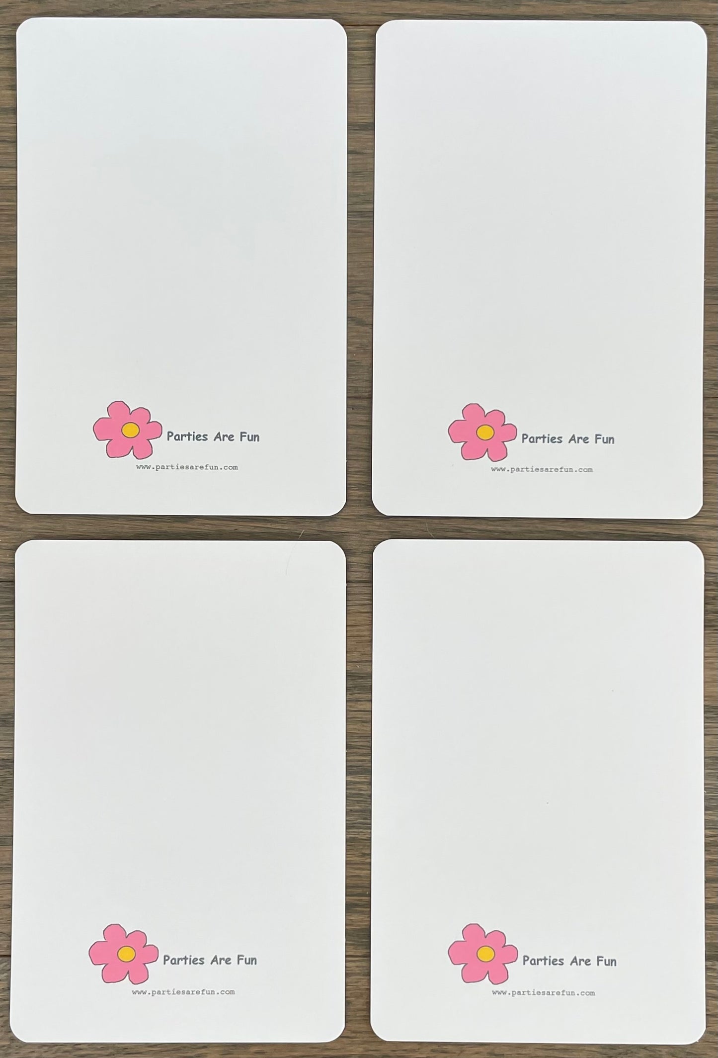 Picture of Parties Are Fun logo on the back of four card